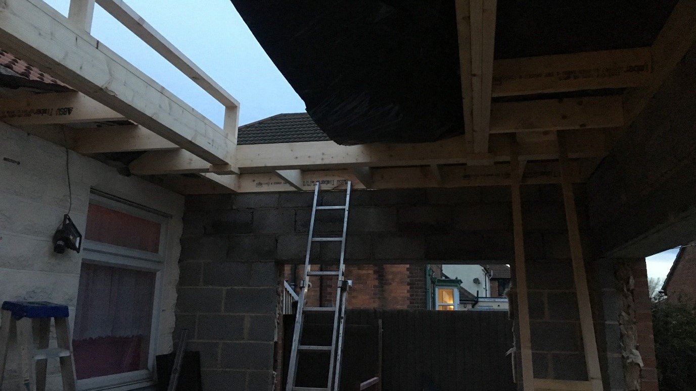 roofer's fatal fall - A construction site with a ladder and some wooden beams on the roof area - a construction director was handed a suspended prison sentence after a roofer fell from height and died from his injuries. 