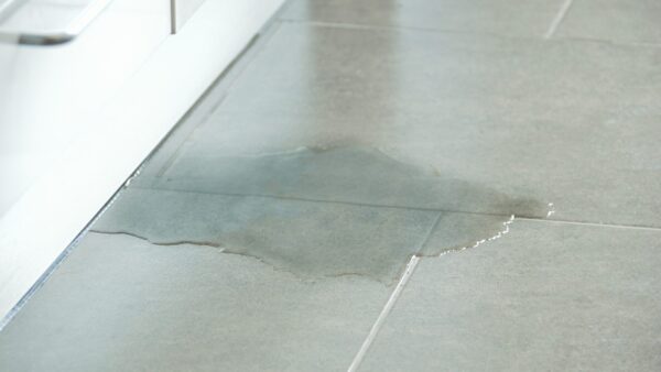 Close-up Photo Of Flooded Floor In Kitchen From Water Leak - The Housing Ombudsman has identified several maladministration cases in handling with serious repairs.