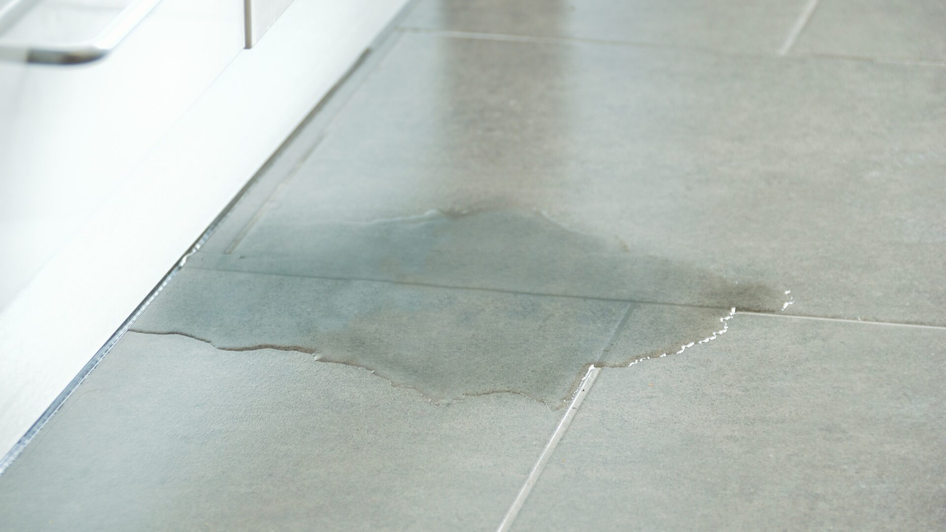 Accent housing association Close-up Photo Of Flooded Floor In Kitchen From Water Leak - The Housing Ombudsman has identified several maladministration cases in handling with serious repairs.
