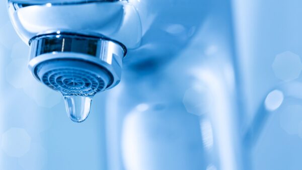 Tap closeup with dripping waterdrop - Amanda Williams from CIOB shares ways developers can adopt water saving measures