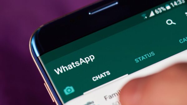 A finger going on a smartphone's screen showing a WhatsApp dashboard - A lawyer reviews a recent High Court case which ruled a contract made over WhatsApp was valid.