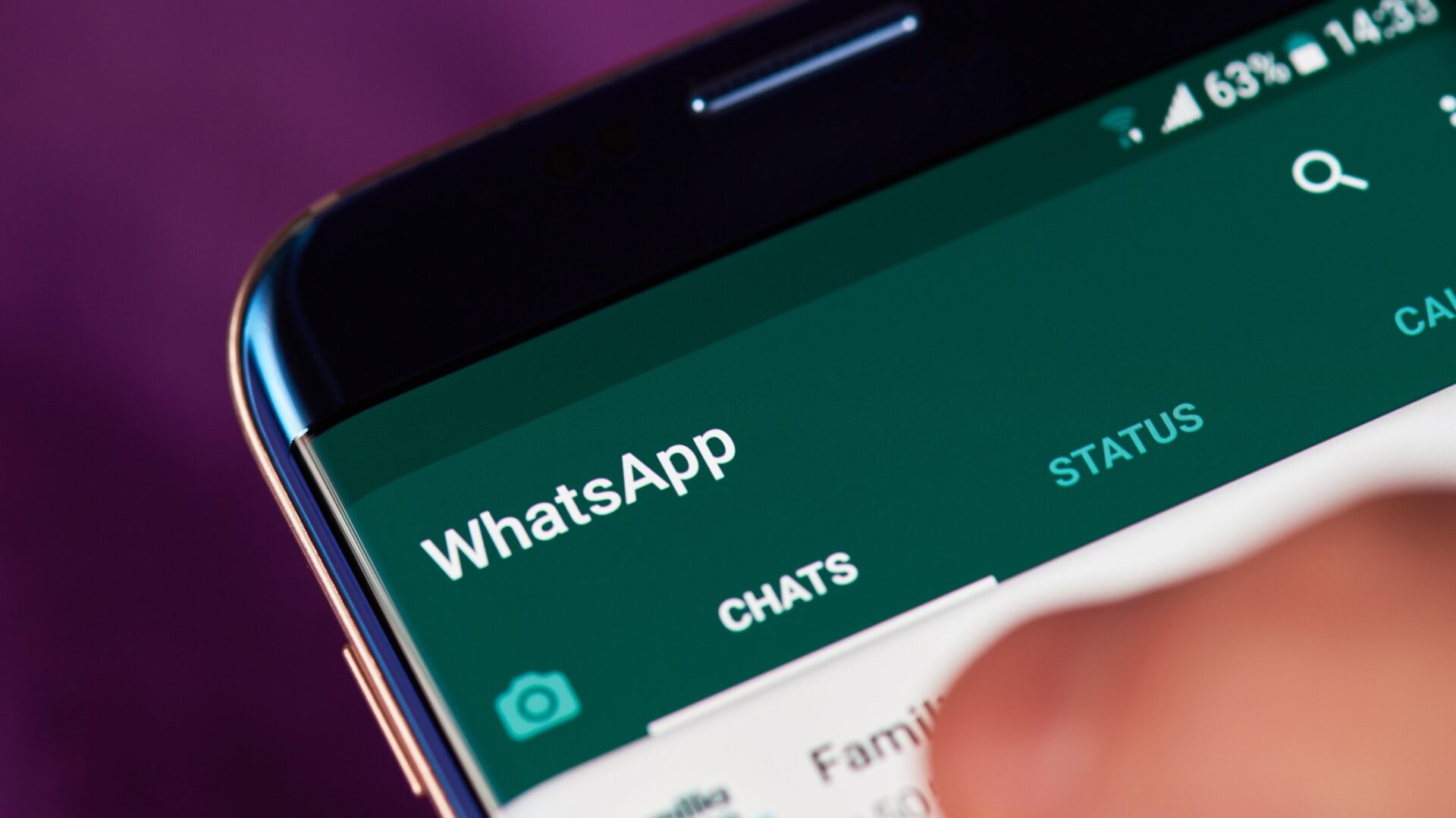 A finger going on a smartphone's screen showing a WhatsApp dashboard - A lawyer reviews a recent High Court case which ruled a contract made over WhatsApp was valid.