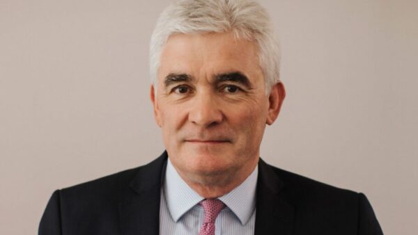 Mugshot of a middle-aged man with tie and jacket looking at the camera - Andrew Davies is retiring as Kier's CEO in October 2025.