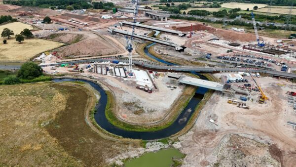 Aerial view of the River Cole with a construction site around it - HS2 has completed the realignment of the river