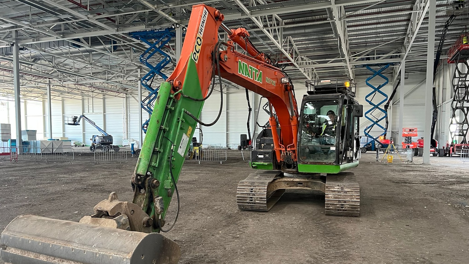 Photo of a Natta Building Company excavator carrying out precision grading