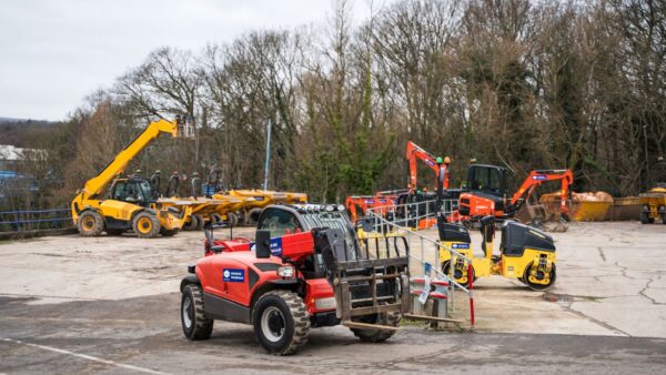 A piece of red plant machinery with other equipment on the background - Henry Boot to expand use of lower-carbon HVO fuel following successful Banner Plant trial
