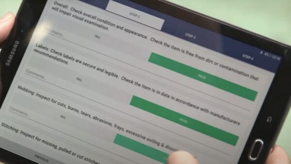 Someone using CoreRFID's equipment inspections app