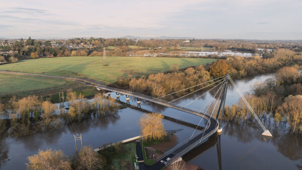 The cable-stayed pedestrian and cycle bridge has a ‘hockey stick’ deck alignment to avoid flood-prone areas. Image: Moxon Architects