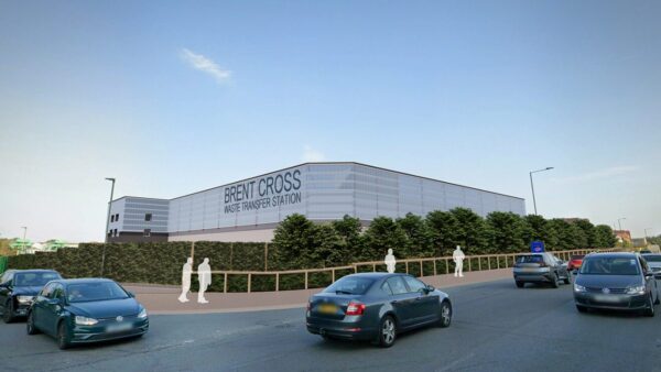 A computer-generated image of the new waste transfer station that McLaughlin & Harvey will build. It's a low big facility surrounded by a road with people and cars.