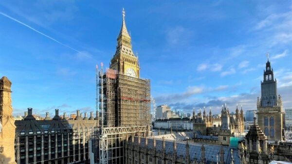 The Elizabeth Tower in Westminster covered almost up to the top in scaffolding.