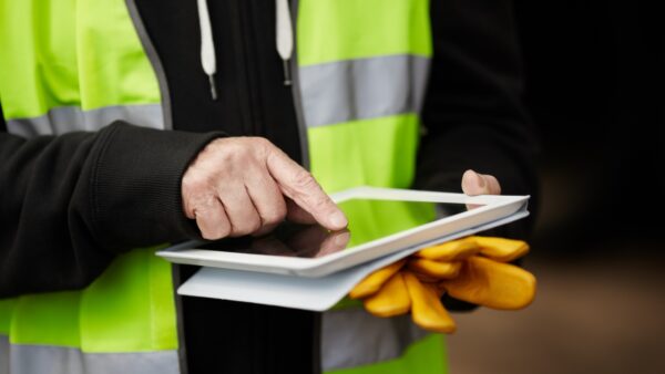 Image of site staff using an iPad on site for internet installation on site story