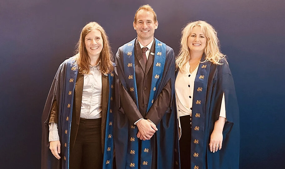 Hermosa, Crichton and Collas at the graduation ceremony. Image courtesy of Collas