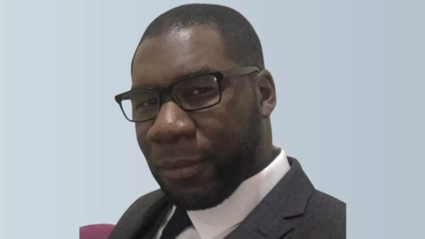 Mugshot of a man smiling at the camera - Ayo Allu