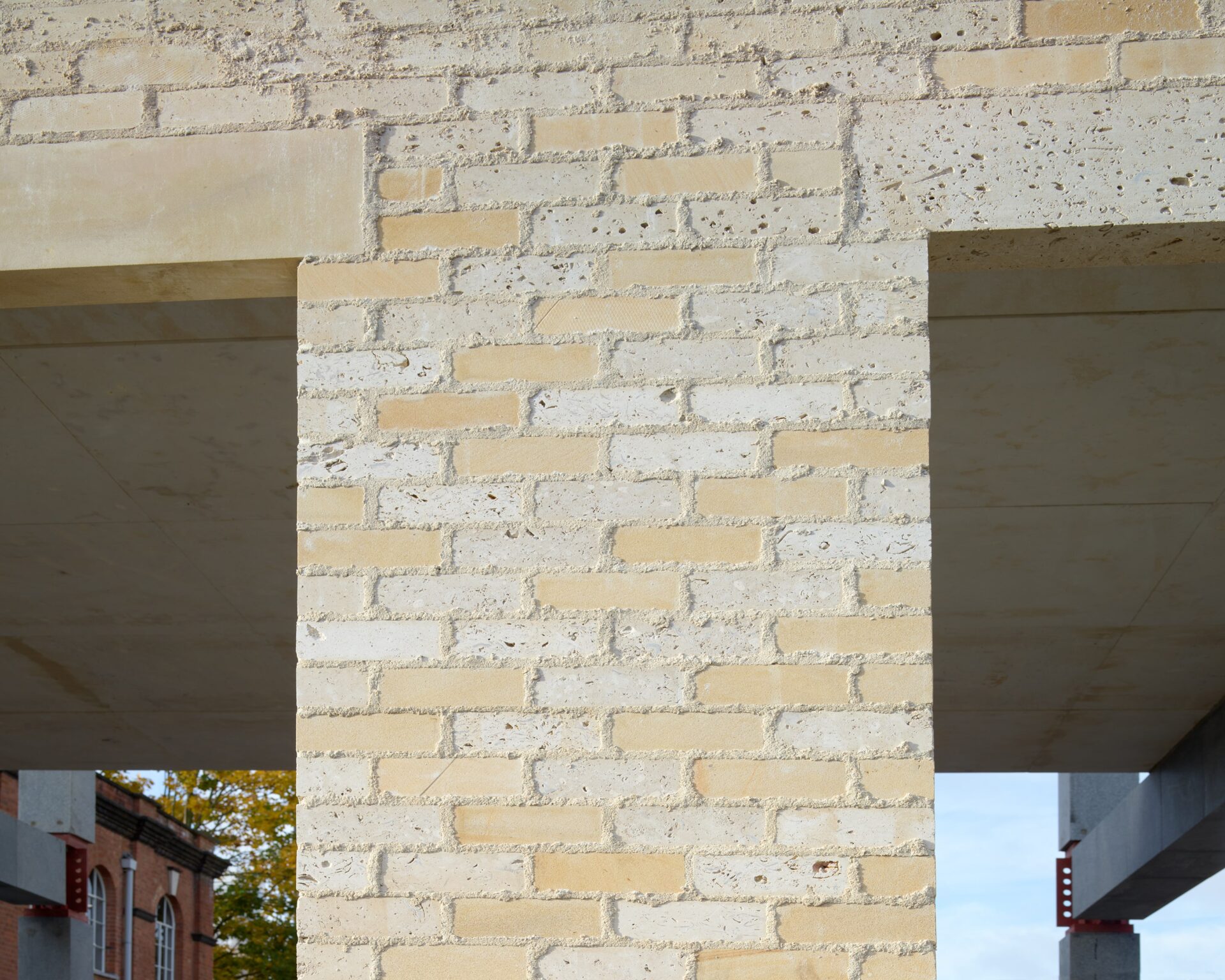 Stone Demonstrator - Close up of a wall made of light-coloured bricks